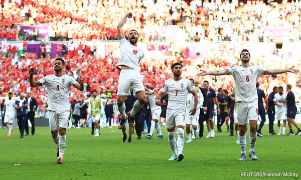 Iranian fans savour victory but wrangle over protests