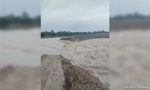 Strong currents break wall on flood mitigation project, causes deluge