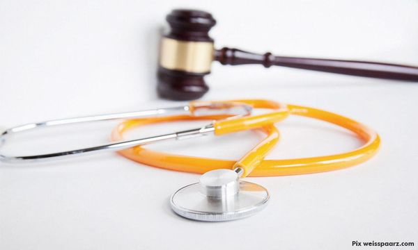 Two hospital staff on remand, taking bribes for funeral management work