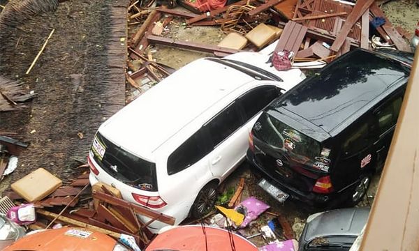 Tsunami waves reach Japan's coast following major quakes