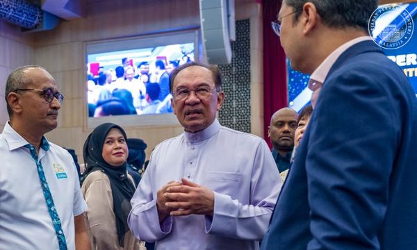 As polls loom, Anwar says he'll continue to mend Sabah BN-GRS ties