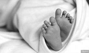 Newborn baby boy found abandoned by roadside