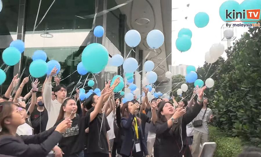 Stabbing victim's favourite colours fill the sky as mourners bid farewell