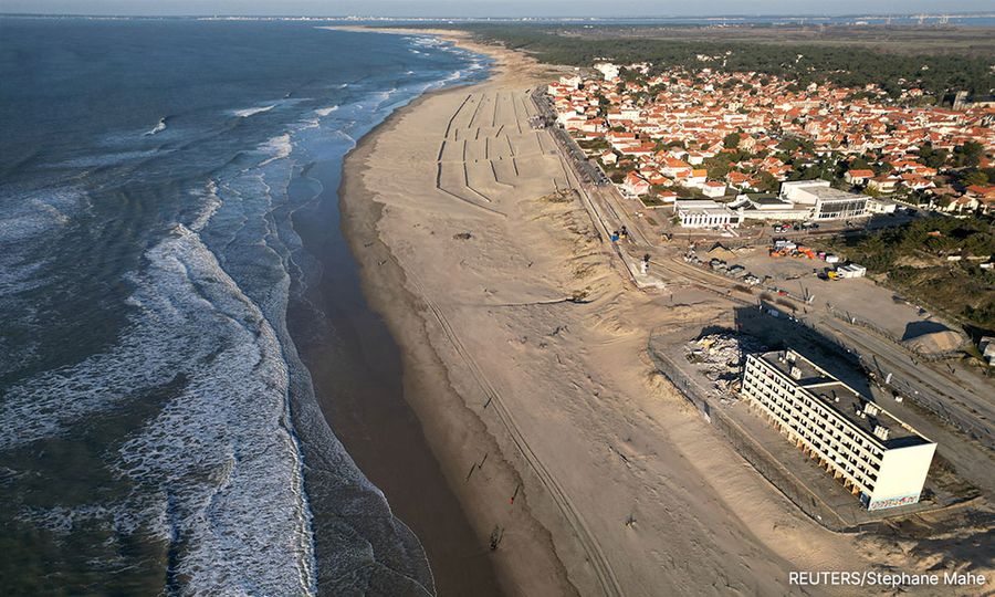 France tears down beach apartment block as rising sea bites